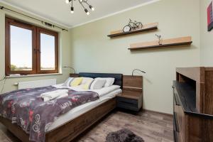 Posteľ alebo postele v izbe v ubytovaní Apartment Na Zakolu Wisły by Noclegi Renters