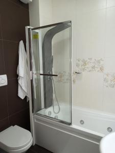 a glass shower in a bathroom with a toilet at La Luna e il Sole in Barletta