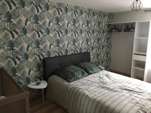 Posteľ alebo postele v izbe v ubytovaní Gîte des falaises