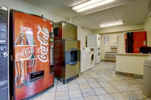 a room with a cocacola machine in a store at Motel 6-Tucker, GA - Atlanta Northeast in Tucker