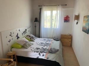 a bedroom with a bed and a window at joy in Lajares