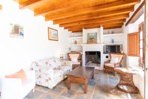 a living room with a couch and a fireplace at Finca Sta Teresa, Casa Grande in Estepona