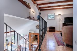 a living room with a staircase and a couch at Villa Anja in Pražnice
