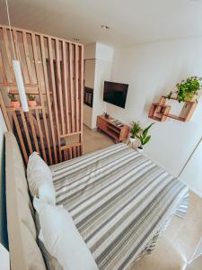 Televiisor ja/või meelelahutuskeskus majutusasutuses Depto moderno a cuadras del mar frente a Shopping Aldrey