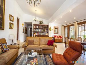 a living room with a couch and a table at VH CostaBlanca - FONDA in Casas de Torrat