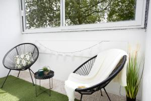 Posedenie v ubytovaní LeCosyMelunais : Parking gratuit + Balcon aménagé