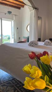 Letto o letti in una camera di Antico Mondo Rooms & Suites