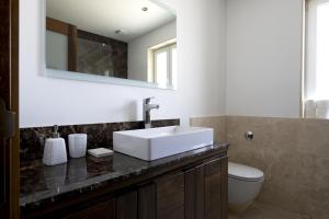 a bathroom with a sink and a toilet at Luxurious 3 bedroom apartment with breathtaking views - MMAI1-1 in St Julian's +20 photos