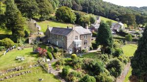 an aerial view of a large house on a hill at Hillside Haven, panoramic views Nr Bakewell in Great Rowsley