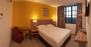 Ένα ή περισσότερα κρεβάτια σε δωμάτιο στο HOTEL ORKID PORT KLANG