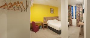 Ένα ή περισσότερα κρεβάτια σε δωμάτιο στο HOTEL ORKID PORT KLANG