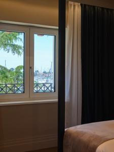 Ein Bett oder Betten in einem Zimmer der Unterkunft Palazzo Rainis Hotel & Spa - Small Luxury Hotel - Adults Only