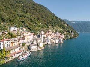 a small town on the shore of a river at Via Scale Apartments, Lake Como, Brienno in Brienno
