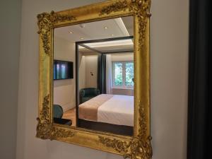 Ein Bett oder Betten in einem Zimmer der Unterkunft Palazzo Rainis Hotel & Spa - Small Luxury Hotel - Adults Only