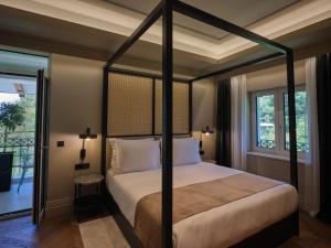 Ein Bett oder Betten in einem Zimmer der Unterkunft Palazzo Rainis Hotel & Spa - Small Luxury Hotel - Adults Only