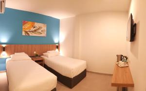 Ένα ή περισσότερα κρεβάτια σε δωμάτιο στο HOTEL ORKID PORT KLANG
