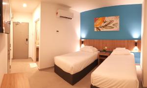 Ένα ή περισσότερα κρεβάτια σε δωμάτιο στο HOTEL ORKID PORT KLANG