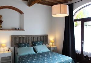 Postel nebo postele na pokoji v ubytování Agriturismo Il Broletto