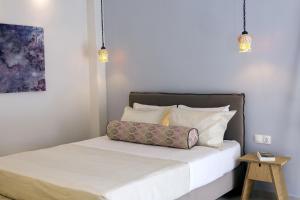 Postel nebo postele na pokoji v ubytování Edward Art Boutique Hotel