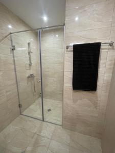 a bathroom with a shower with a glass door at Sea Dreams Studio in Sveti Vlas