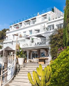 a hotel with a bunch of bananas in front of it at Hotel de La Plage - Mahogany in Cassis