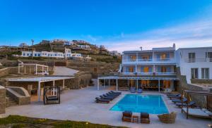 a villa with a swimming pool on a hill at VILLA MAJESTIC CIEL Private beach in Mýkonos City