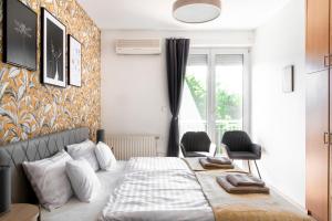 Posteľ alebo postele v izbe v ubytovaní Balaton Lakeside Residence + 21 fotografií