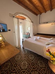 En eller flere senger på et rom på Antico Mondo Rooms & Suites