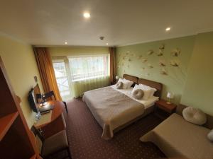 Postel nebo postele na pokoji v ubytování Hotel Green Smiltynė + 37 fotografií