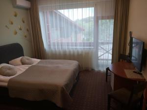 Postel nebo postele na pokoji v ubytování Hotel Green Smiltynė