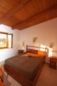 a bedroom with a large bed in a room at Agriturismo L'Istrice di Giò in Montalto di Castro