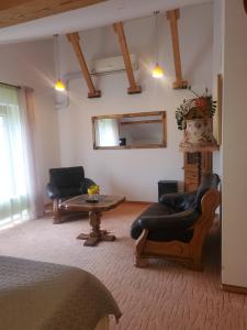 a living room with two chairs and a table at Hotel Green Smiltynė in Panevėžys