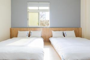 Llit o llits en una habitació de Blue Lagoon