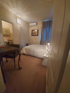 A bed or beds in a room at Mulino dell'Abbazia Country Resort
