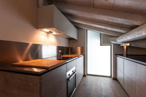 a kitchen with a wooden counter top in a room at Topazio suite in Mantova