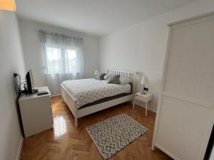 Ένα ή περισσότερα κρεβάτια σε δωμάτιο στο Experience Sibenik Apartments