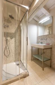 a bathroom with a shower and a sink at Topazio suite in Mantova +26 photos