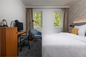 Voodi või voodid majutusasutuse OREA Hotel Špičák Šumava toas