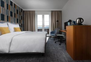Voodi või voodid majutusasutuse OREA Hotel Špičák Šumava toas