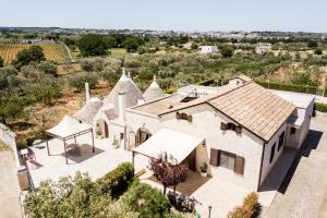an aerial view of a house with a roof at Trulli Nuova Aia Resort in Alberobello