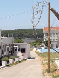 a house with a view of a body of water at Apartment D&E Punat - free Wi-Fi and parking in Punat