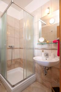 a bathroom with a shower and a sink at Villa Fio - Rooms & Studio in Hvar