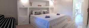 A bed or beds in a room at Bed&breakfast BBqueen Sandonato Policlinico