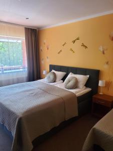 Postel nebo postele na pokoji v ubytování Hotel Green Smiltynė