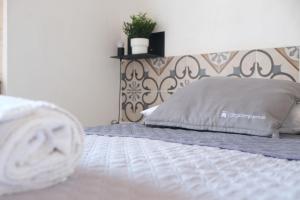 Postel nebo postele na pokoji v ubytování Largo Imperiali B&B