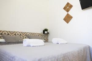 Postel nebo postele na pokoji v ubytování Largo Imperiali B&B