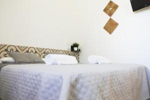 Postel nebo postele na pokoji v ubytování Largo Imperiali B&B