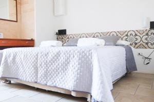 Postel nebo postele na pokoji v ubytování Largo Imperiali B&B