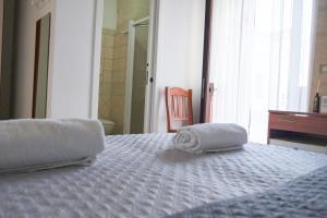 Postel nebo postele na pokoji v ubytování Largo Imperiali B&B