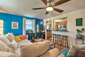 a living room with a couch and a ceiling fan at Patio, Grill and Yard Cozy Denver Abode! in Denver
